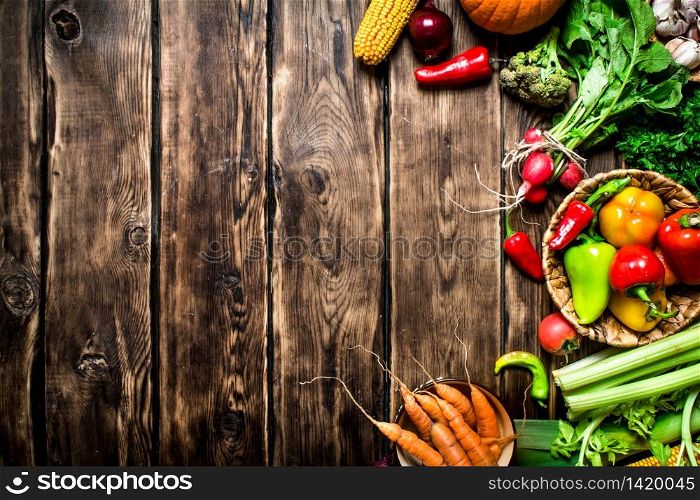 Healthy food. Organic vegetables. Fresh vegetables with herbs. On wooden background.. Fresh vegetables with herbs.