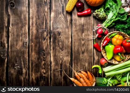 Healthy food. Organic vegetables. Fresh vegetables with herbs. On wooden background.. Fresh vegetables with herbs.