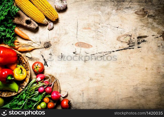Healthy food. Organic vegetables. Fresh vegetables with herbs. On wooden background.. Healthy food. Organic vegetables.
