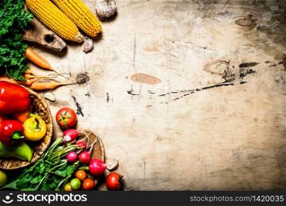 Healthy food. Organic vegetables. Fresh vegetables with herbs. On wooden background.. Healthy food. Organic vegetables.
