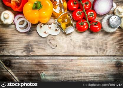 Healthy food. Ripe organic vegetables with spices. On a wooden background.. Healthy food. Ripe organic vegetables with spices.