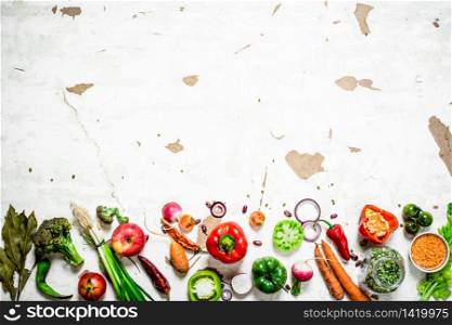 Healthy food. Slices of fresh vegetables and fruits. On rustic background .. Healthy food. Slices of fresh vegetables and fruits.