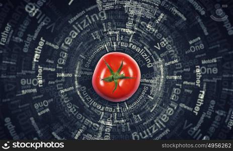 Healthy food. Tomato against black background with business sketches