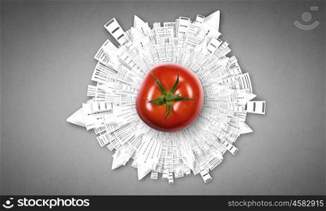 Healthy food. Tomato against white background with business sketches