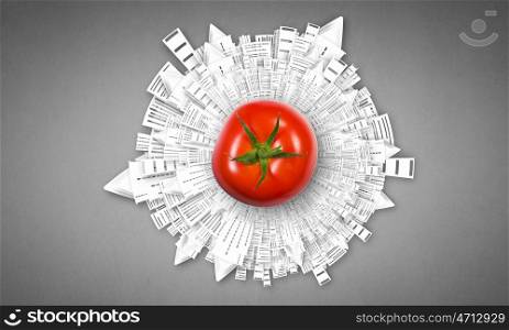 Healthy food. Tomato against white background with business sketches