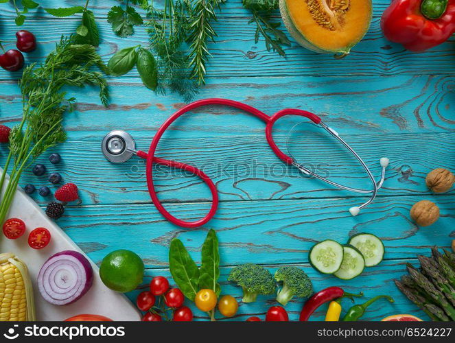 Healthy food vegetables for heart heath on wooden turquoise background. Healthy food vegetables for heart heath on wood