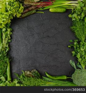 Healthy food. Vegetables  On a black wooden background
