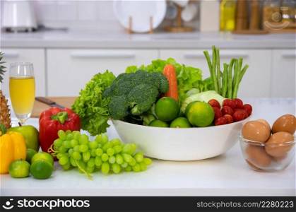 Healthy foods of fresh vegetables, fruits, eggs and pineaple juice on white table in home kitchen . Home healthy lifestyle concept