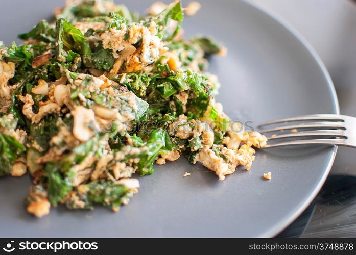 healthy fresh green kale with scrambled eggs