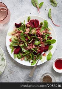 Healthy fresh salad. Beetroot, red chard and canned tuna salad. Healthy Meal recipe preparation. Plant-based dishes. Green living. Vegetarian recipes. Food styling. Organic food. Vegetarian cuisine