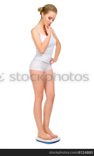 Healthy girl on scales isolated