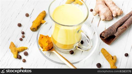 Healthy golden milk. Golden remedy milk with turmeric,ginger,pepper and cinnamon