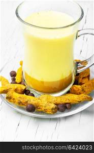 Healthy golden milk. Turmeric Golden milk in a glass cup