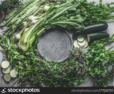 Healthy green food background frame with green vegetables and  herbs ingredients, top view.