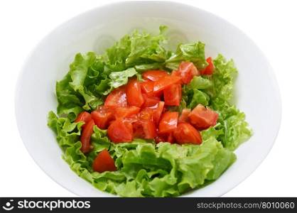 Healthy green salad, tomatoes in white bowl. Isolated on white.