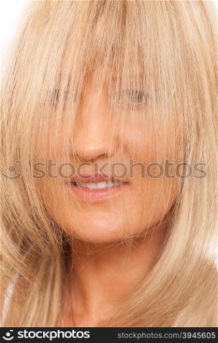 Healthy hair hairstyling hairdressing concept. Woman covering her face with long straight hair.