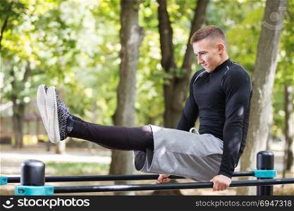 Healthy handsome active man with fit muscular body doing workout exercises. Healthy handsome active man with fit muscular body doing workout exercises.
