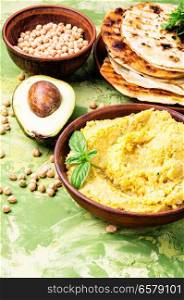 Healthy homemade creamy hummus of chickpeas. Classic hummus with on the plate