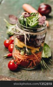 Healthy Homemade Mason Jar Salad with Beans and Veggies - Healthy food, Diet, Detox, Clean Eating or Vegetarian concept. Healthy Homemade Mason Jar Salad, healthy food