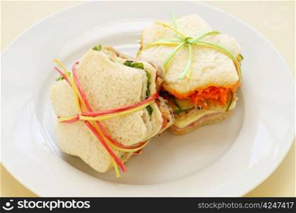 Healthy kids sandwiches cut in the shape of a star and tied up.