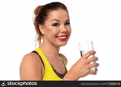 Healthy life concept - beautiful and young woman holds glass with fresh water on a white background.