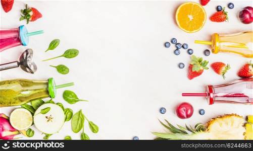 Healthy lifestyle background with various colorful smoothie drinks in bottles, blender and ingredients on white wooden. Detox and diet food concept.