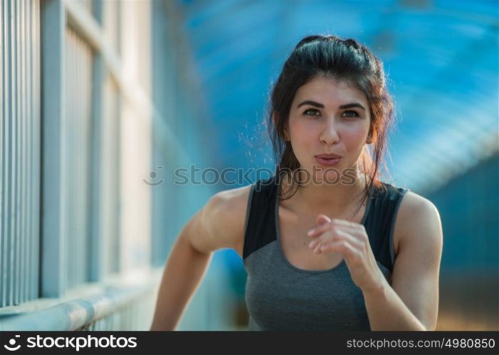Healthy lifestyle beautiful woman running at the city urban background