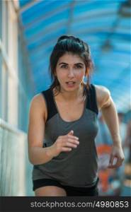 Healthy lifestyle beautiful woman running at the city urban background