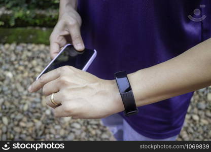 Healthy lifestyle concept female wearing sport tracker wristband arm, stock photo