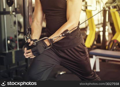 Healthy lifestyle concept. Sport man exercising at fitness club,. Healthy lifestyle concept. Sport man exercising at fitness club, training on row machine at gym.