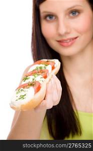 Healthy lifestyle - happy woman eat caprese sandwich