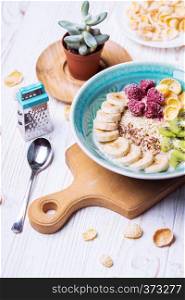 healthy lifestyle. healthy food - oatmeal with banana, kiwi and raspberries