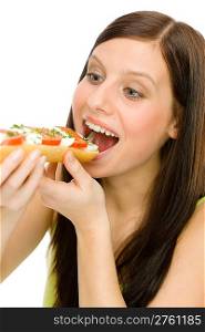 Healthy lifestyle - portrait of happy woman eat caprese sandwich