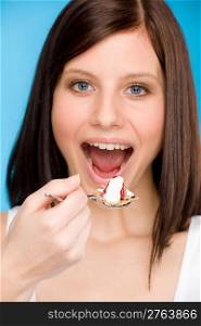 Healthy lifestyle - portrait of woman eat cereal yogurt with spoon