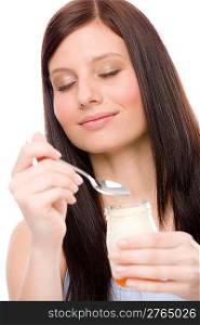 Healthy lifestyle - portrait of young woman enjoy yogurt