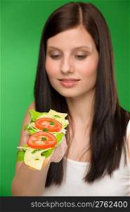 Healthy lifestyle - portrait woman enjoy cheese tomato sandwich