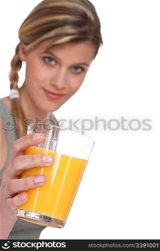 Healthy lifestyle series - Woman with glass of orange juice on white background, focus on hand