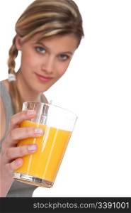 Healthy lifestyle series - Woman with glass of orange juice on white background, focus on hand