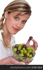 Healthy lifestyle series - Woman with grapes in bowl on white background