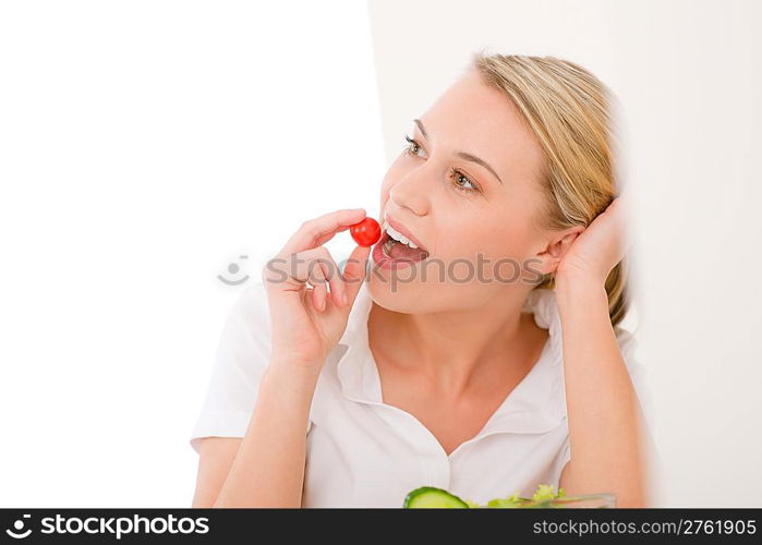 Healthy lifestyle - smiling woman with vegetable salad on white