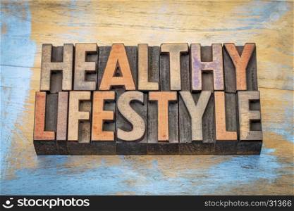 healthy lifestyle - word abstract in vintage letterpress wood type blocks against grunge wood