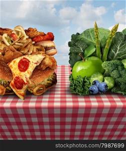Healthy living concept and diet decision symbol or nutrition choices dilemma between healthy good fresh fruit and vegetables or greasy cholesterol rich fast food on a picnic table with a cloth trying to decide what to eat.