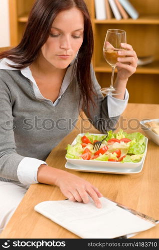 Healthy lunch at home attractive woman read magazine drink wine