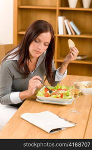 Healthy lunch at home attractive woman read magazine eat salad