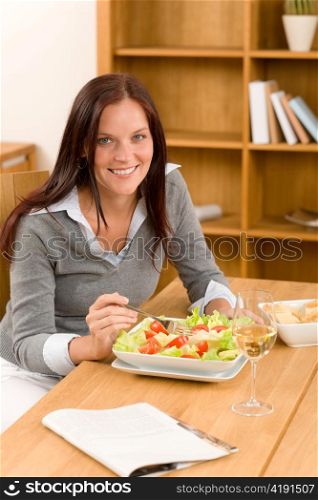 Healthy lunch at home attractive woman read magazine eat salad