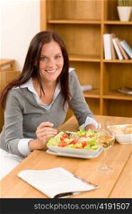 Healthy lunch at home attractive woman read magazine eat salad