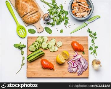 Healthy lunch cooking. Clean eating layout and diet nutrition concept. Various fresh vegetables ingredients and roasted chicken or turkey meat for salad on white table background, top view