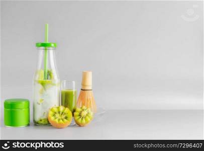 Healthy matcha espresso and iced matcha fusion latte in bottle with drinking straw and matcha tee in tin can. Antioxidant boost beverages. Detox and clean eating concept. Summer refreshing beverages
