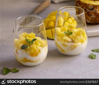 healthy meal with yogurt pineapple glass
