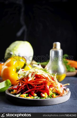 Healthy mixed vegetables and leaves eco salad. Red salad with beetroot, carrot and herbs.